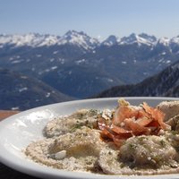 Home-made ravioli with a view of Cermis - Fresh hand-made ravioli with speck and breathtaking views of Cermis
