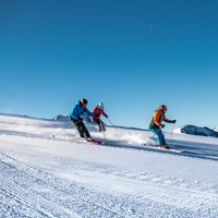 Three friends skiing down Cermis slopes - Three friends and a ski day on Cermis

